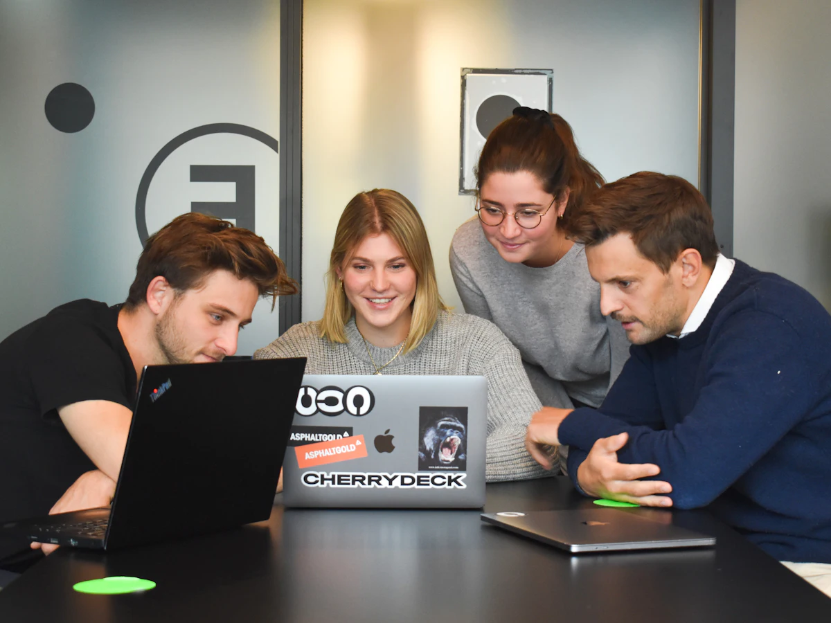Colleagues working together on a laptop